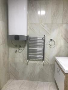 a bathroom with a shower with a toilet and a sink at Doğa apart 