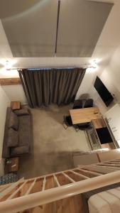 a room with a bed and a desk and a curtain at Petrina Bolosis in Palaiókastron