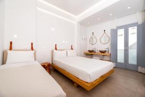Ένα ή περισσότερα κρεβάτια σε δωμάτιο στο Hotel Thira