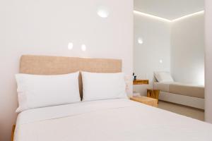 Ένα ή περισσότερα κρεβάτια σε δωμάτιο στο Hotel Thira