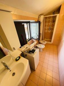 a bathroom with a sink and a toilet at La Villetta in Cansano