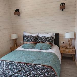 Ένα ή περισσότερα κρεβάτια σε δωμάτιο στο Lodge avec vue imprenable !