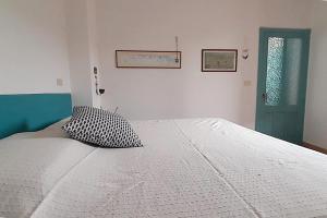 Postel nebo postele na pokoji v ubytování Sa Mannalissa casa vacanza