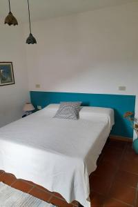 Postel nebo postele na pokoji v ubytování Sa Mannalissa casa vacanza