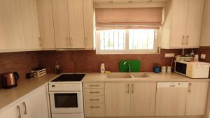 A kitchen or kitchenette at Anastasia's House near Kalamata