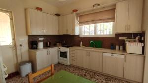 A kitchen or kitchenette at Anastasia's House near Kalamata