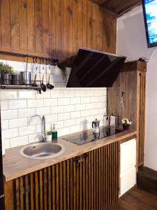 a kitchen with a sink and a counter top at Casita rústica in Cambre