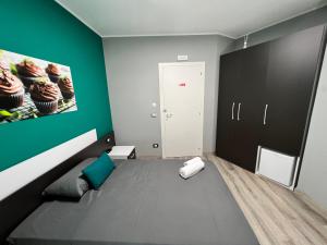 Voodi või voodid majutusasutuse Siclari B&B-Rooms&Suite toas