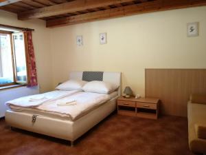 Postel nebo postele na pokoji v ubytování Flóra Apartmanok