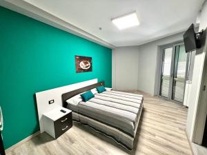 Voodi või voodid majutusasutuse Siclari B&B-Rooms&Suite toas