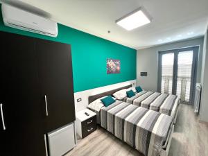 Voodi või voodid majutusasutuse Siclari B&B-Rooms&Suite toas