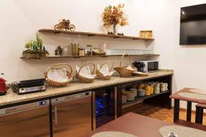a kitchen with a counter with baskets on it at Casa do Visconde 