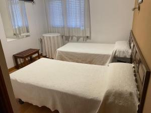 Katil atau katil-katil dalam bilik di Hotel relojero