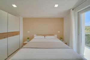 Postel nebo postele na pokoji v ubytování BLACK DIAMOND Apartment