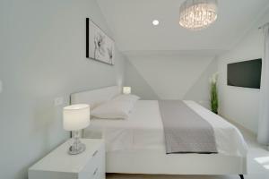 Postel nebo postele na pokoji v ubytování BLACK DIAMOND Apartment