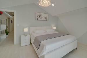 Postel nebo postele na pokoji v ubytování BLACK DIAMOND Apartment