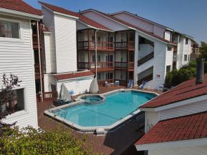 an overhead view of a swimming pool in front of a building at Beach Room 214 in Traverse City