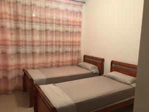 Postel nebo postele na pokoji v ubytování résidence à Fnideq plage
