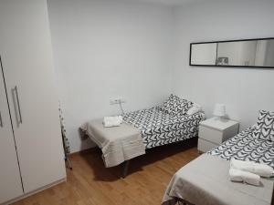 Posteľ alebo postele v izbe v ubytovaní Apartament Roses Platja-Ciutadella