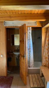 a bathroom with a shower and a sink at Saulėtekio 12 in Ignalina +1 photo