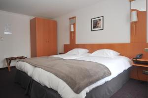 Letto o letti in una camera di Hôtel du Perron