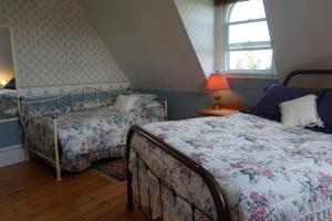 a bedroom with two beds and a window at The New Glasgow Inn in New Glasgow