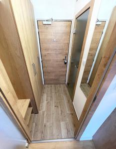 a hallway in a house with a wooden door at ne-doma in Chomutov