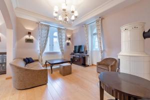 a living room with a couch and a table at Luxury apartment Diamond in Karlovy Vary