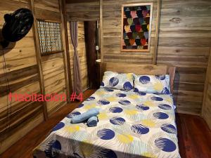 Postel nebo postele na pokoji v ubytování Palm Beach Hostal
