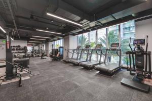 a gym with treadmills and machines in a room at Wonderful 1 BR Apartment with At Downtown Miami in Miami
