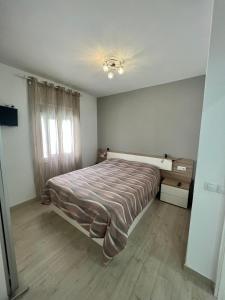 Postel nebo postele na pokoji v ubytování Los Cristianos || + 23 fotografií