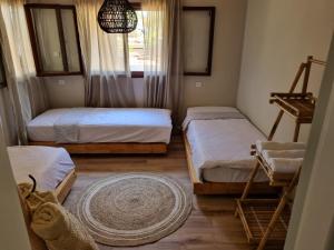Postel nebo postele na pokoji v ubytování בית בעמק