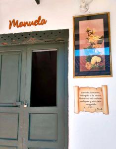 a door to a building with a sign above it at Casa Museo Alcantus in Puente Nacional