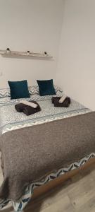 a bed with two slippers on top of it at Benaldream in Benalmádena