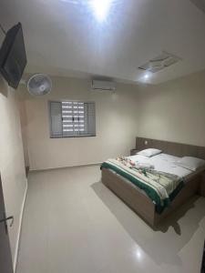 Hotel Aricanduva tesisinde bir odada yatak veya yataklar