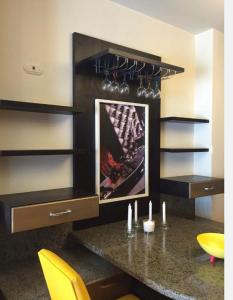 a kitchen with a counter with a picture on the wall at Golf Porto marina in El Alamein
