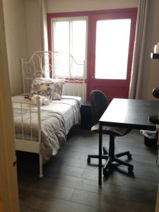 a bedroom with a bed and a desk and a table at Montreal Downtown Suite in Montréal