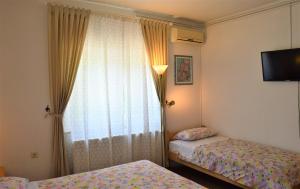 Posteľ alebo postele v izbe v ubytovaní Rooms & Apartments Kvasić