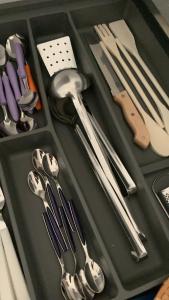 a tray with silver utensils and utensils at InterMezzo - located in the center of Salento equidistant from the 2 seas in Scorrano