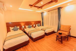 Letto o letti in una camera di Kathmandu Aagantuk Hotel