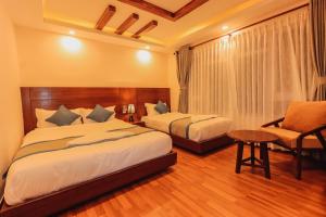 Letto o letti in una camera di Kathmandu Aagantuk Hotel