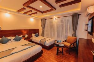 Letto o letti in una camera di Kathmandu Aagantuk Hotel