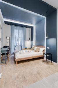 Cama o camas de una habitación en COLLINA 24 SUITES - ROMA CENTER