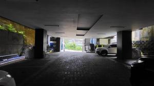 an empty hallway with a car parked in a building at Finteo Skylands Premium in Baguio