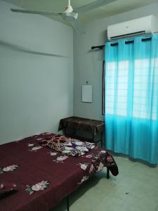 Un pat sau paturi într-o cameră la Homestay Che Wan Satu
