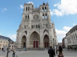 a group of people standing in front of a cathedral at L'Oratoire in Amiens