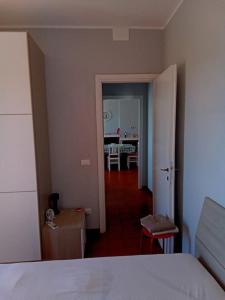 En eller flere senge i et værelse på Appartamento luminosissimo con vista panoramica