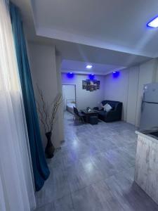 a living room with a couch and a table at MODERN AND COMFORTABLE APARTMENT Self Check In in Yerevan