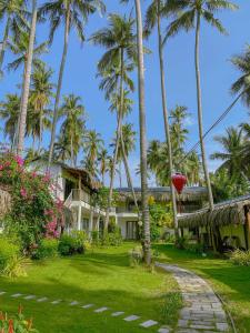 Κήπος έξω από το The Legend Coco Beach