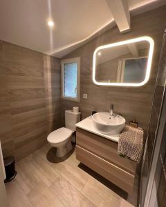 a bathroom with a sink and a toilet and a mirror at Comorebi Provence in Entrecasteaux +45 photos